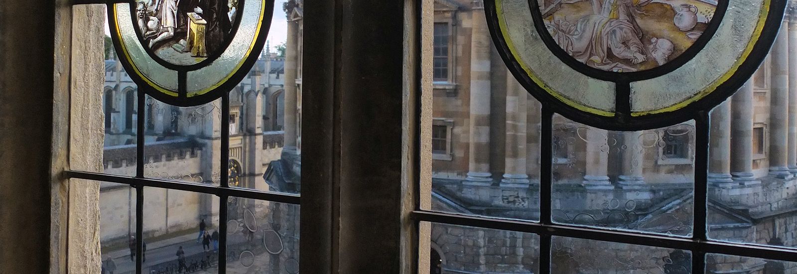 Close up of stain glass windows looking out over Radcliffe Square