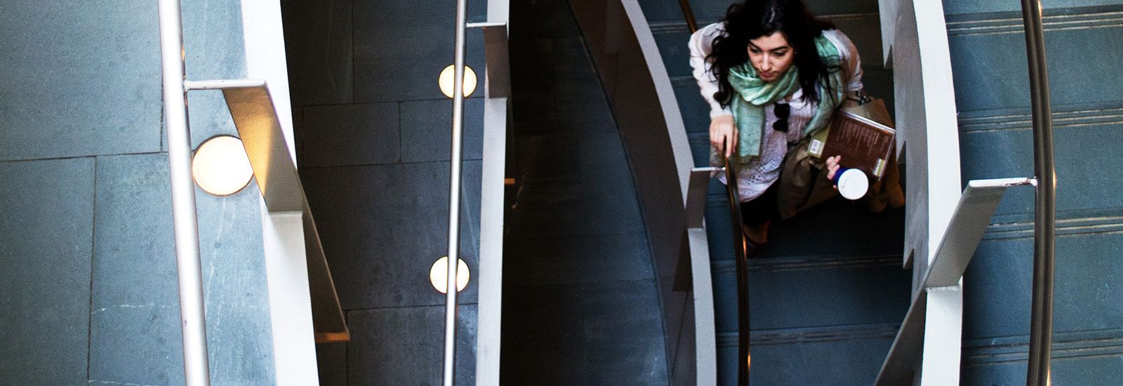 Looking down at a student walking down stairs