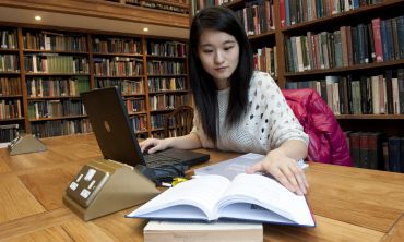 Student working in the library at Somerville College