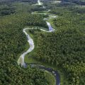 aerial view of the meandering river in a rural landscape.