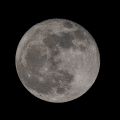 A close up view of the moon, showing a patchwork of mountains across its surface. 